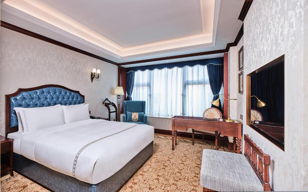 TV a/nebo společenská místnost v ubytování Guangming CIMC Executive Hotel Shenzhen