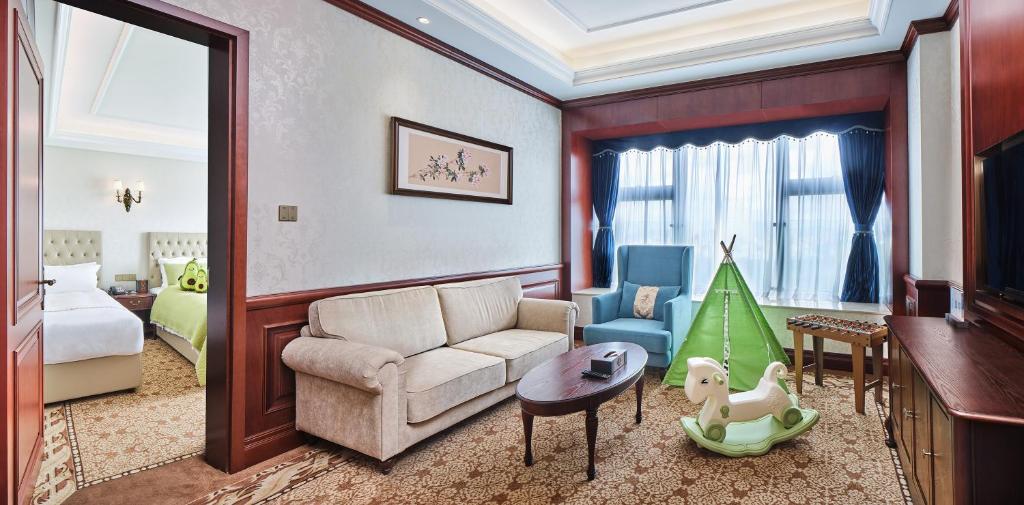 Postel nebo postele na pokoji v ubytování Guangming CIMC Executive Hotel Shenzhen