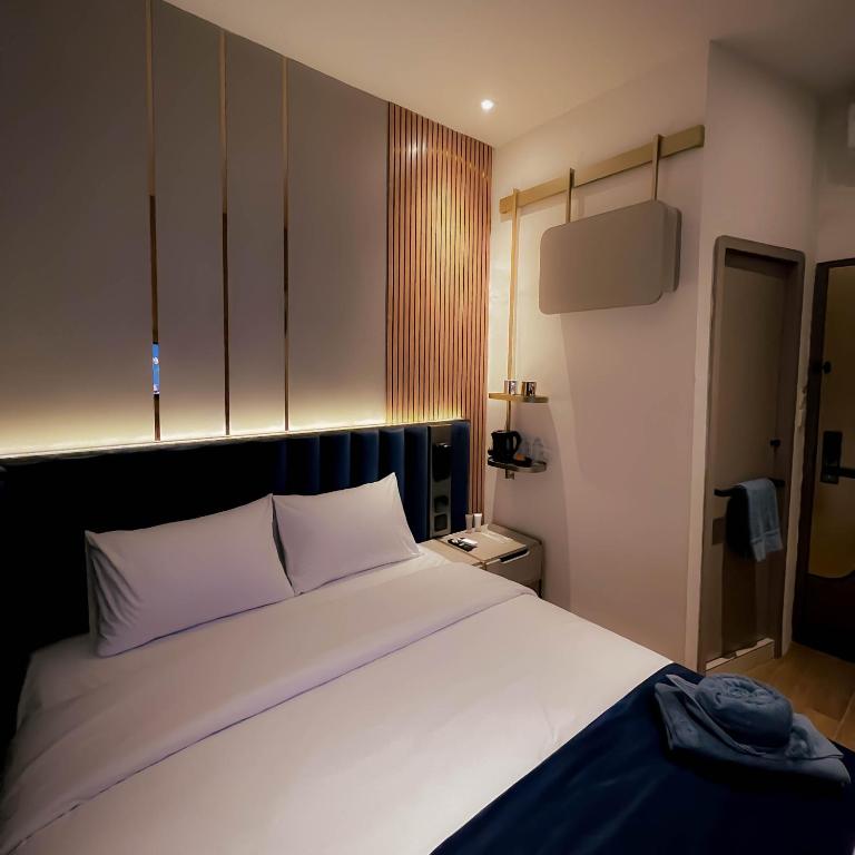 Postel nebo postele na pokoji v ubytování Qube Hotel by 98hospitality