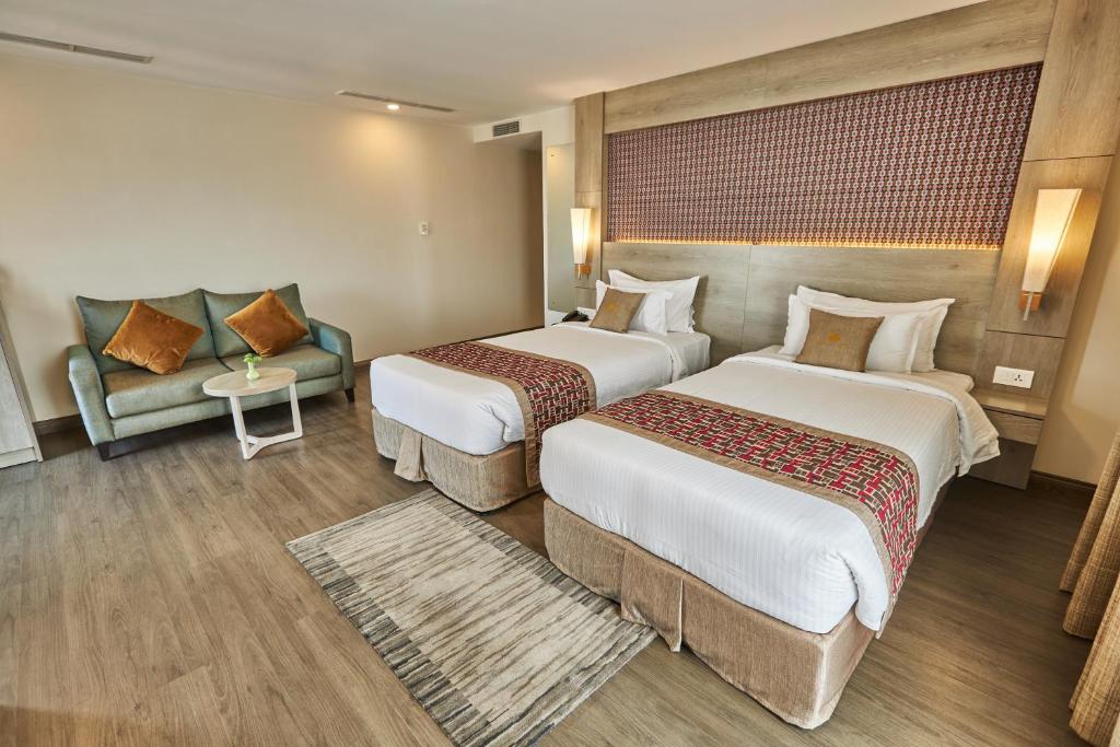 Postel nebo postele na pokoji v ubytování Hotel Crowne Imperial
