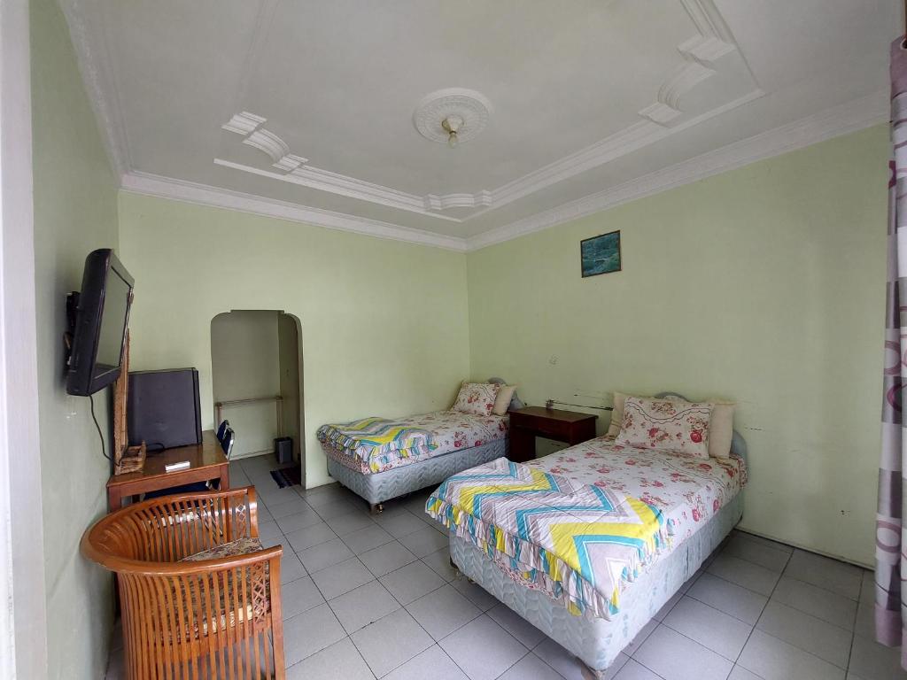 Grand Syariah Guest House Humanitas - Gran Habitación Gemela