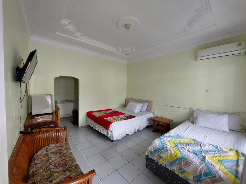 Grand Syariah Guest House Humanitas - Habitación Triple