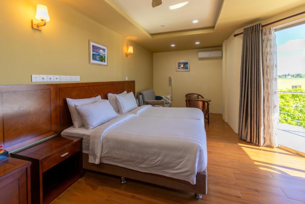 Postel nebo postele na pokoji v ubytování Blue Wave Hotel Maldives- Surf-fishing and beach -Free domestic transport when booked fullboard for a week
