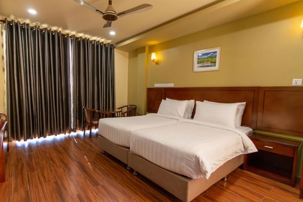 Postel nebo postele na pokoji v ubytování Blue Wave Hotel Maldives- Surf-fishing and beach -Free domestic transport when booked fullboard for a week