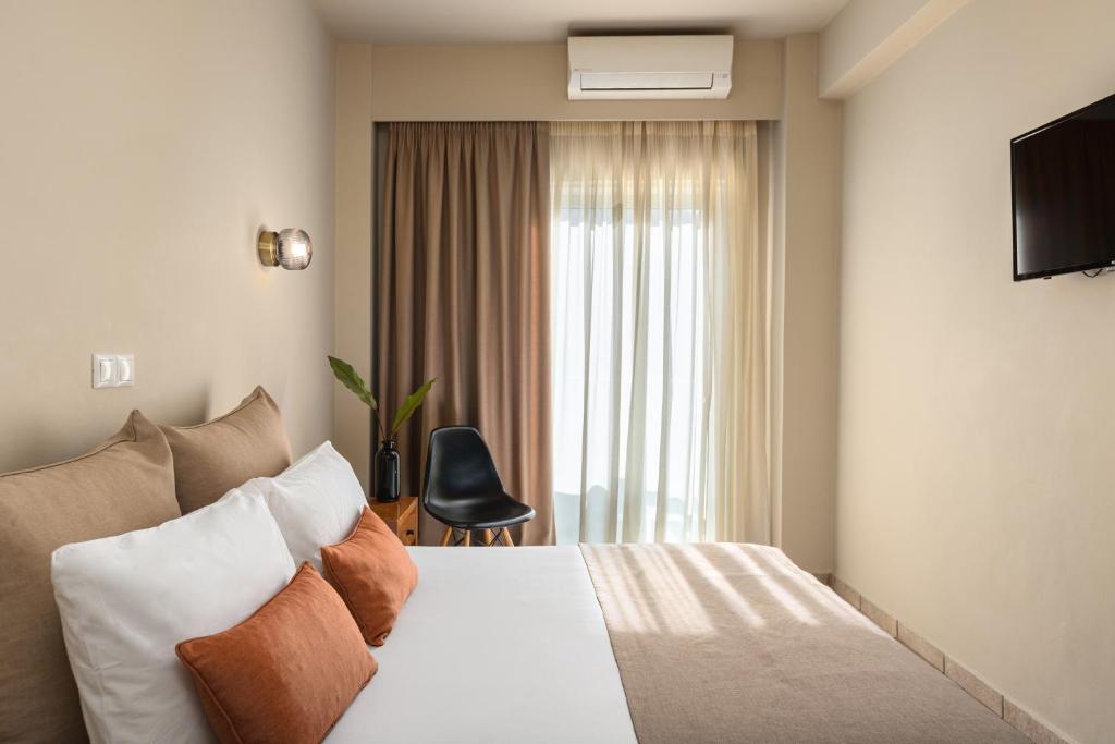 Postel nebo postele na pokoji v ubytování Hotel Delfini