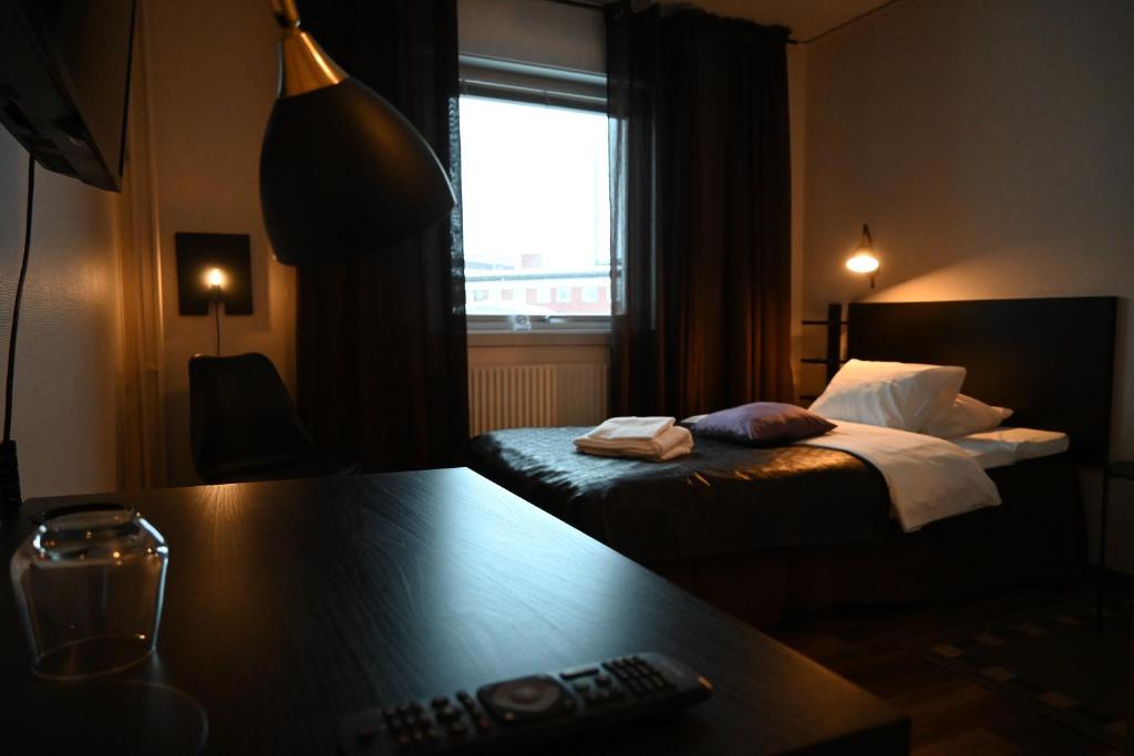Postel nebo postele na pokoji v ubytování Hotell Lyktan