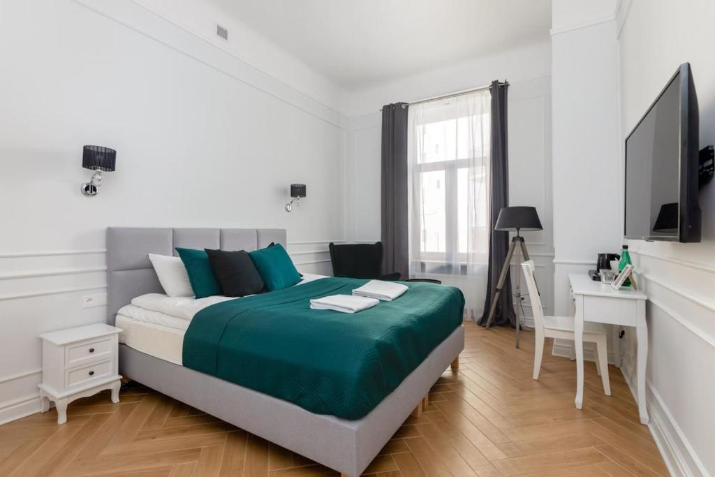 Posteľ alebo postele v izbe v ubytovaní Lwowska 9 - Cozy & Comfortable Studio by Noclegi Renters