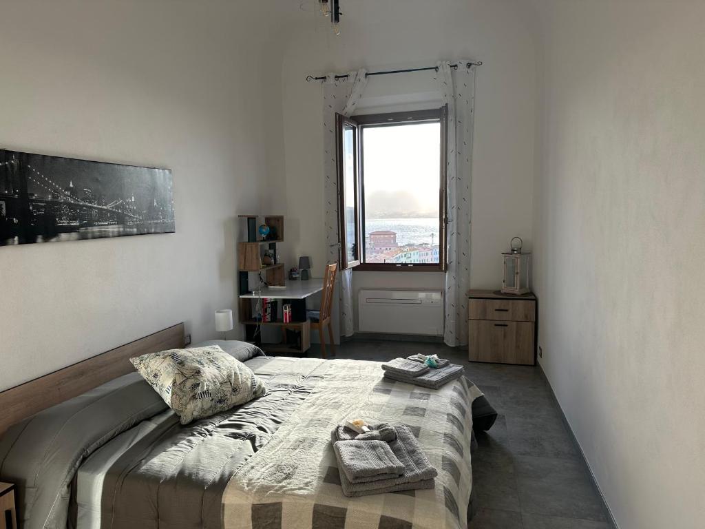 Postel nebo postele na pokoji v ubytování LA SCALINATA
