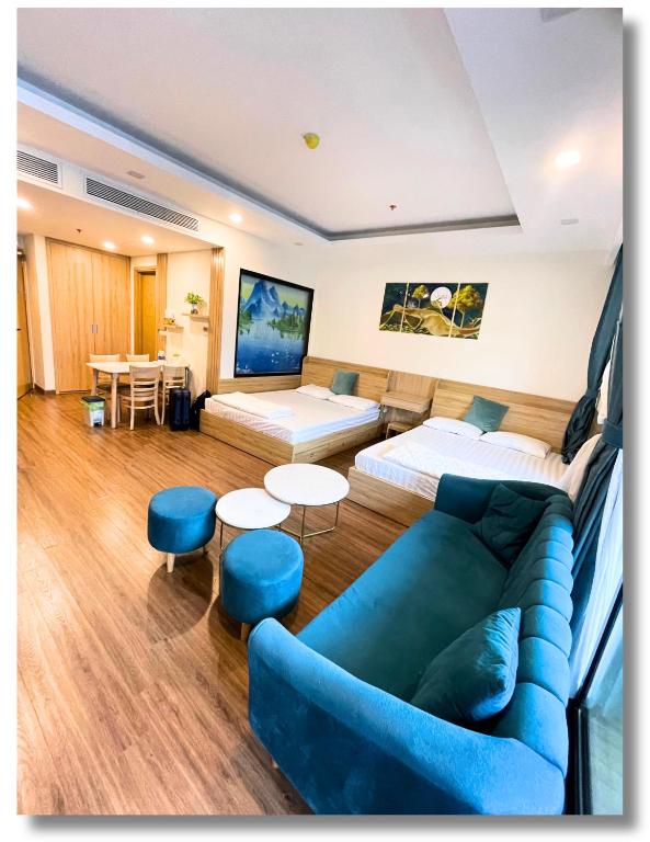 a room with a couch and a bed and a table at FLC Luxury Apartment Quy Nhon in Quy Nhon