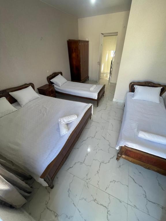 Postel nebo postele na pokoji v ubytování Amfitrita Hotel Ureki