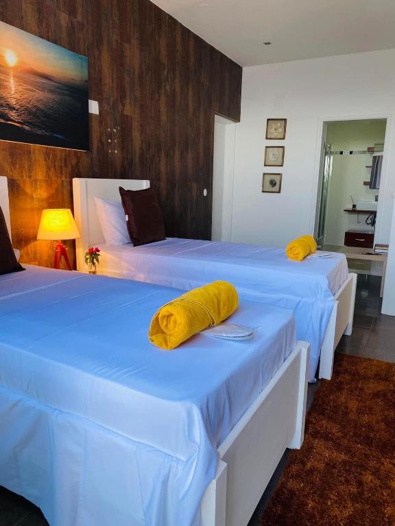 Postel nebo postele na pokoji v ubytování Fogo Boutique Hotel