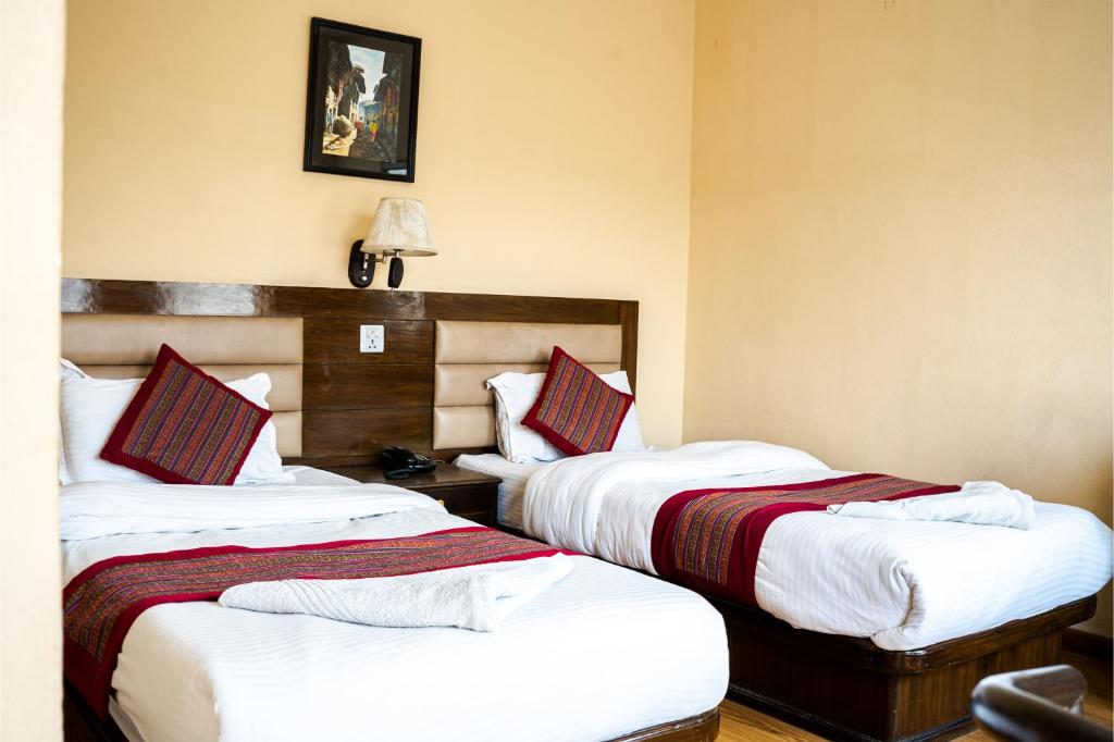 Postel nebo postele na pokoji v ubytování Hotel Namtso