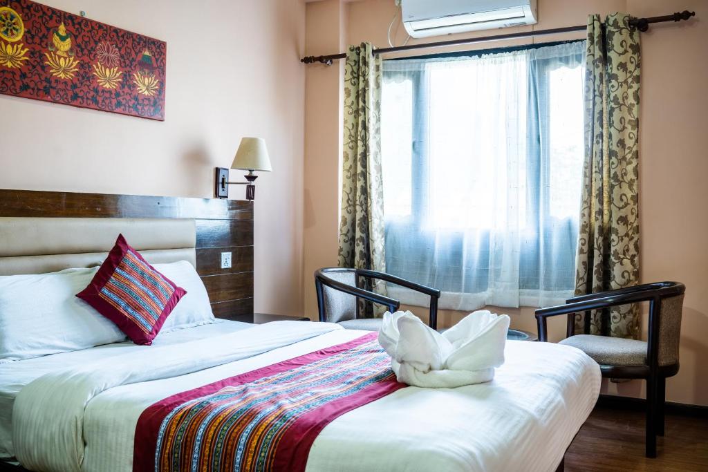 Postel nebo postele na pokoji v ubytování Hotel Namtso