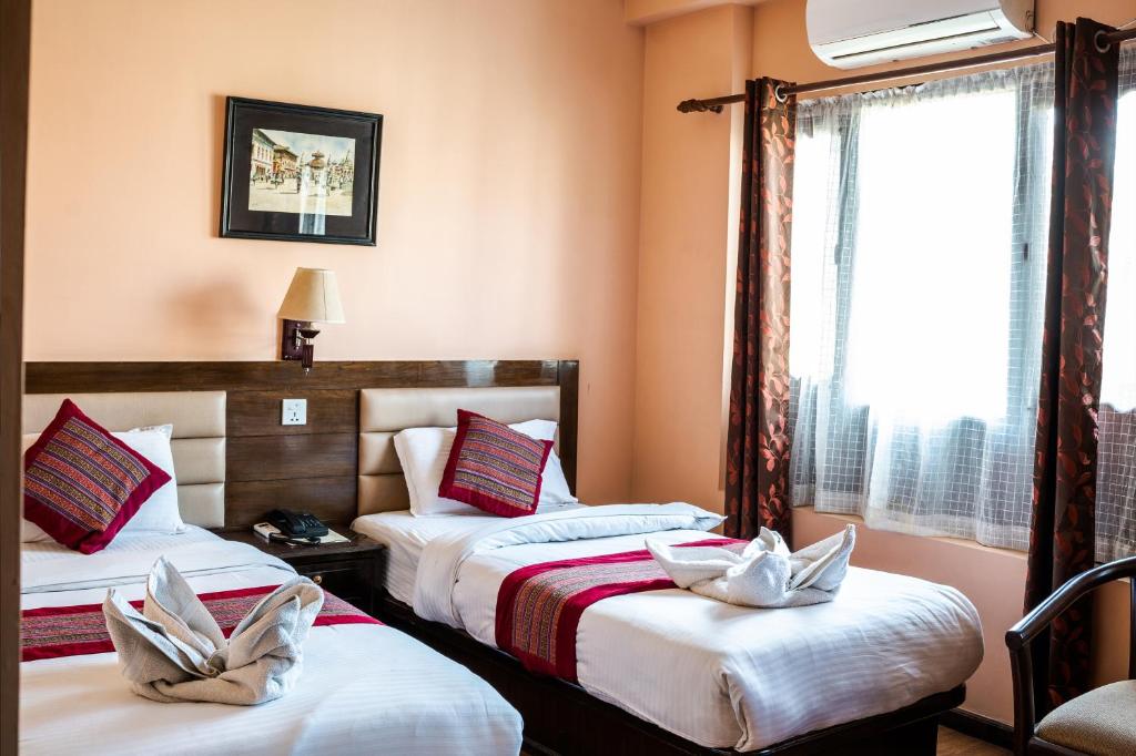Postel nebo postele na pokoji v ubytování Hotel Namtso