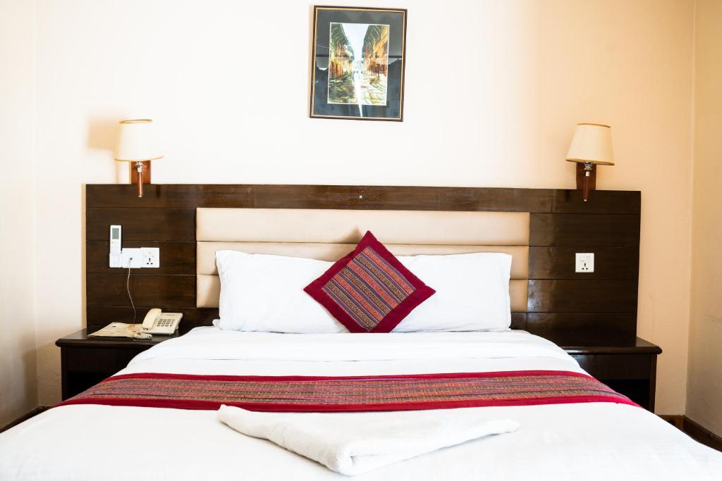 Postel nebo postele na pokoji v ubytování Hotel Namtso