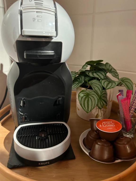 a coffee maker sitting on top of a table at Maison piscine &amp; spa Vallon Pont d&#39;Arc in Vallon-Pont-dʼArc