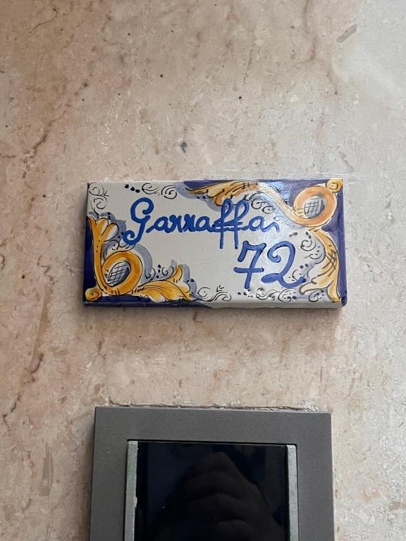 Certyfikat, podpis lub inny dokument wystawiony w obiekcie Garraffa 72 Suite
