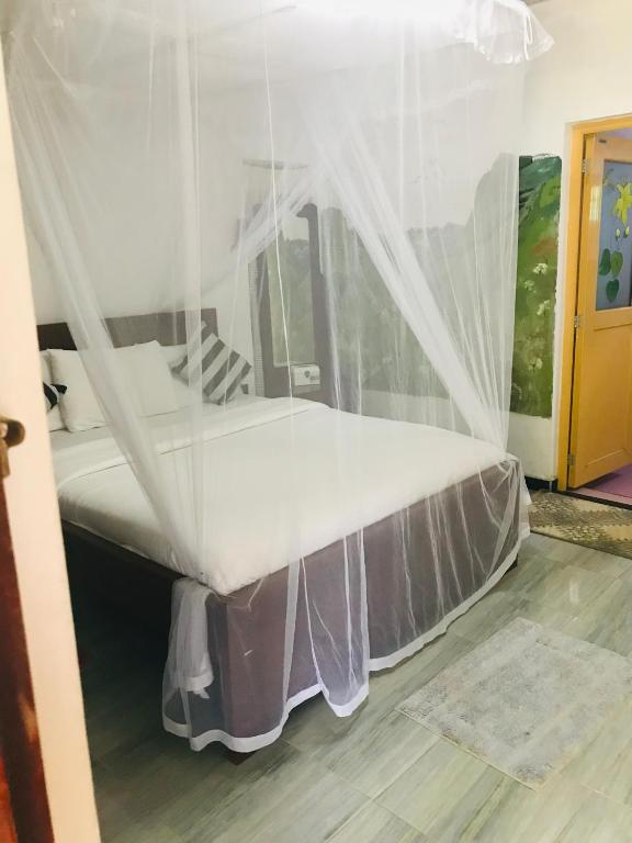 Postel nebo postele na pokoji v ubytování Cinnamon Homestay ella