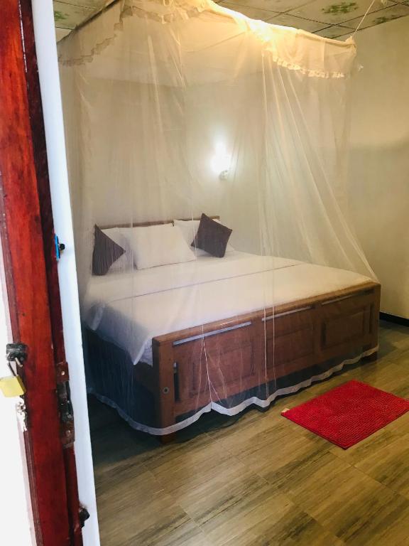 Postel nebo postele na pokoji v ubytování Cinnamon Homestay ella