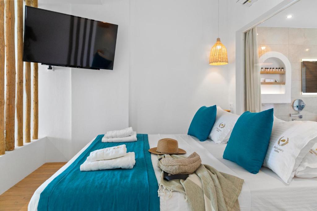 Postel nebo postele na pokoji v ubytování Alia Beachfront Suites and Spa