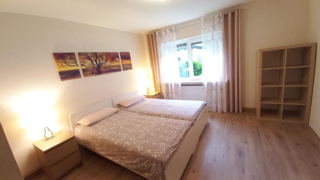 Кровать или кровати в номере Holiday Apartment