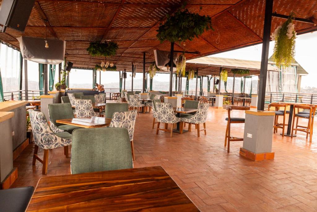 a restaurant with tables and chairs and tables and chairs at Star View Hotel Restaurant and Bar in Kampala