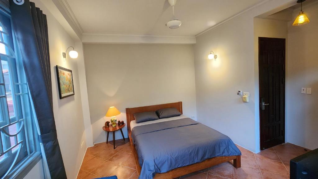 Letto o letti in una camera di T Home Balcony Homestay