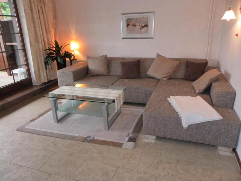 a living room with a couch and a coffee table at Fischerhaus Whg Abendrot in Neukloster