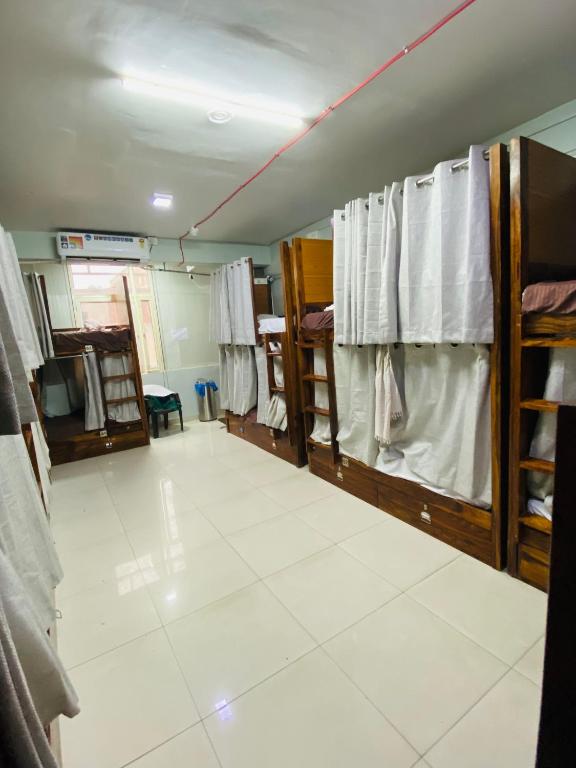 Postel nebo postele na pokoji v ubytování Homestay Ac Dormitory