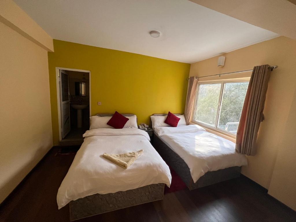 Postel nebo postele na pokoji v ubytování Hotel Village View Nagarkot