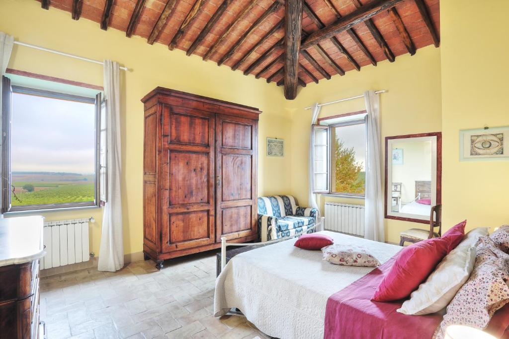 Postel nebo postele na pokoji v ubytování Podere Il Belvedere su Cortona