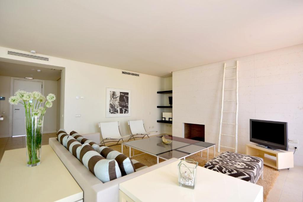 Televízia a/alebo spoločenská miestnosť v ubytovaní Aparthotel Novo Resort