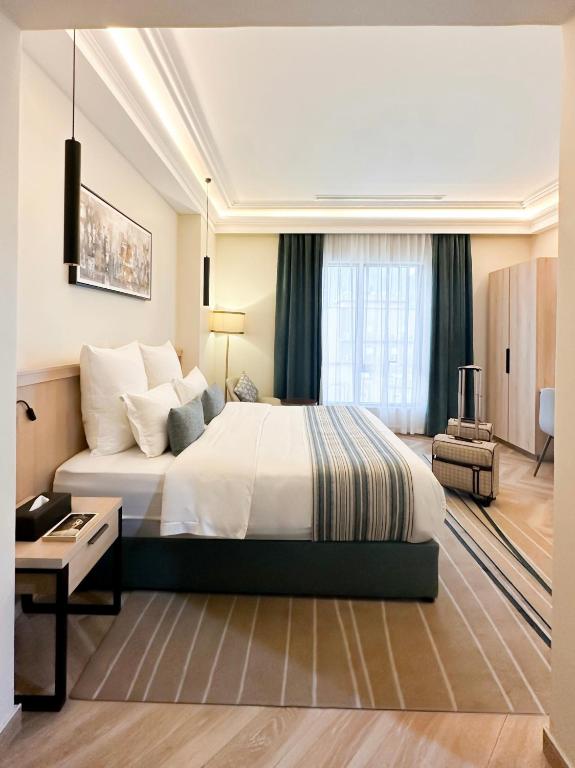 Postel nebo postele na pokoji v ubytování Marlo Hotel - فندق مارلو