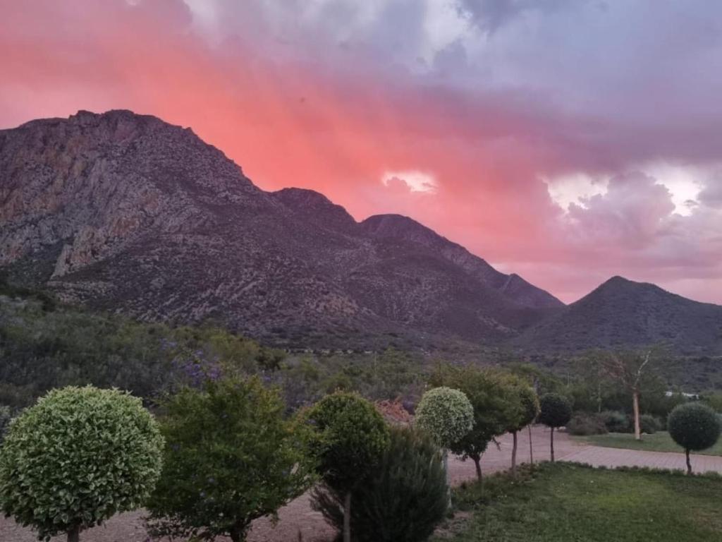 a view of a mountain with a red sky at Oorlogs Kloof Mountain Retreat Montagu in Montagu