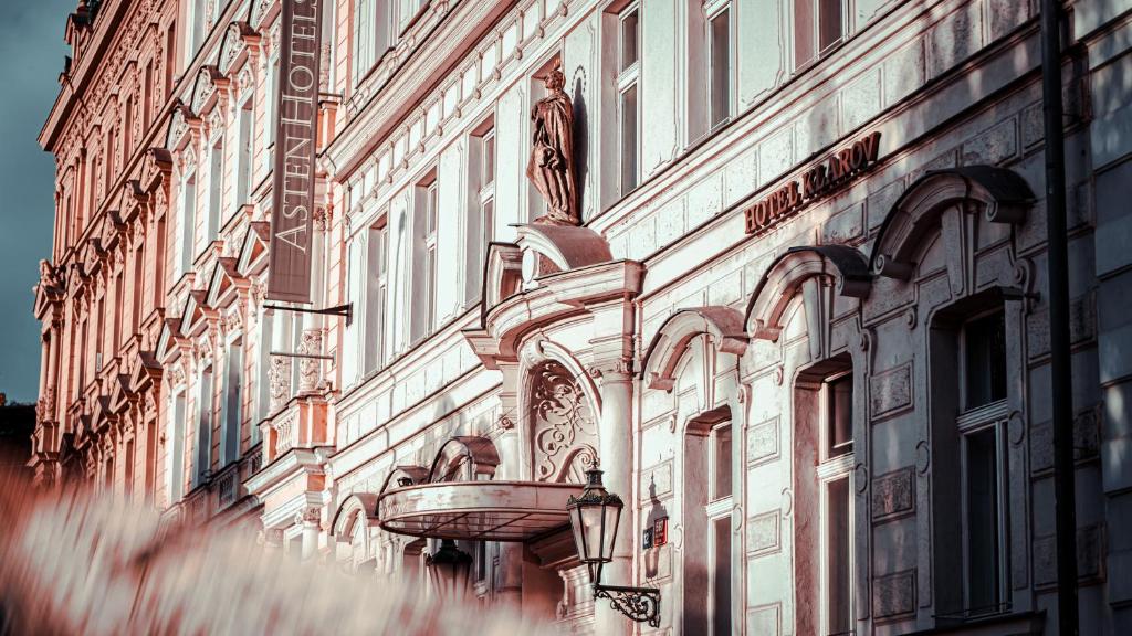 a building with a statue on the side of it at Boutique Hotel Klarov in Prague