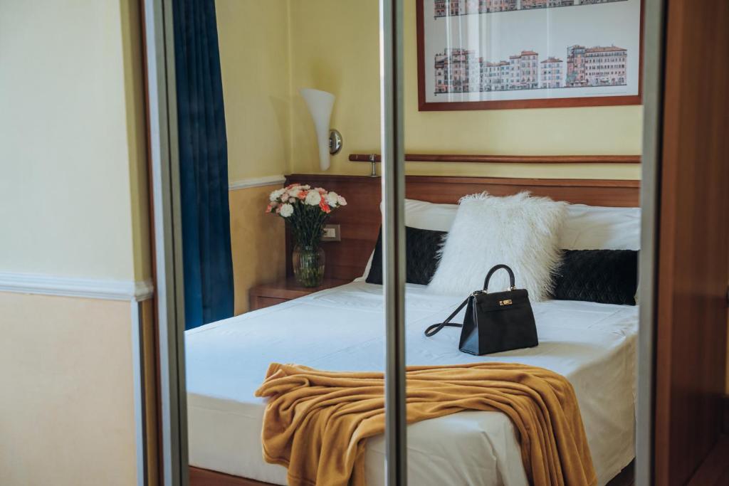 Postel nebo postele na pokoji v ubytování Hotel Windrose