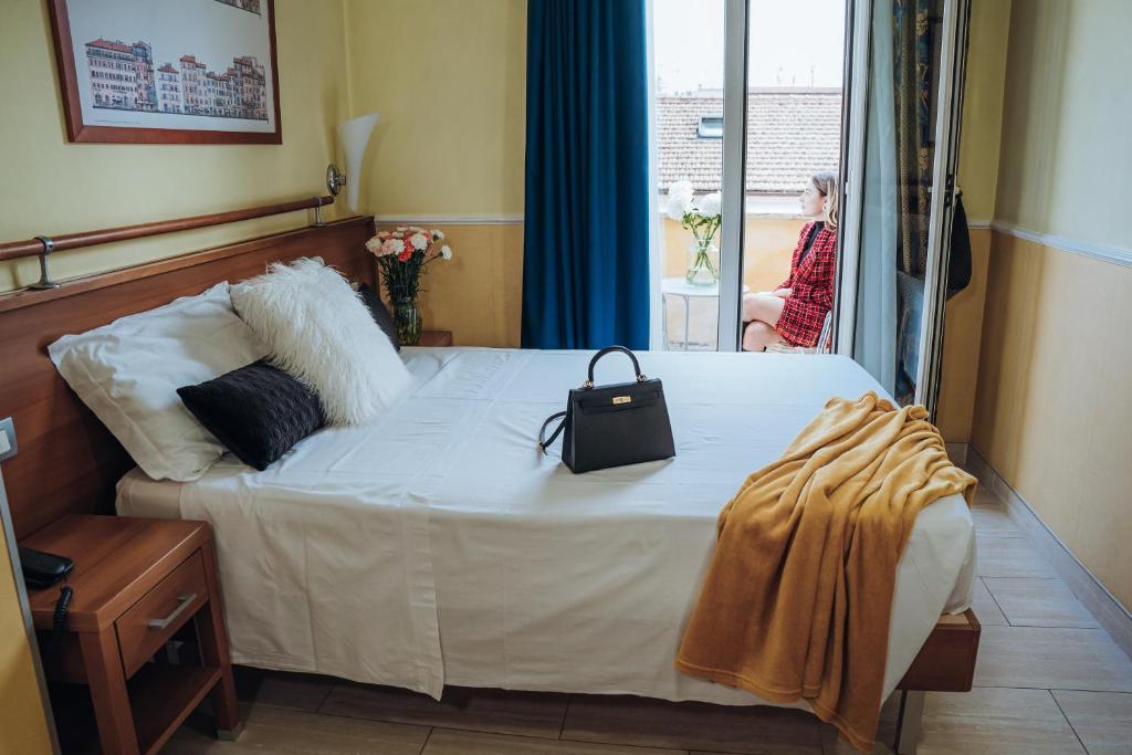 Postel nebo postele na pokoji v ubytování Hotel Windrose