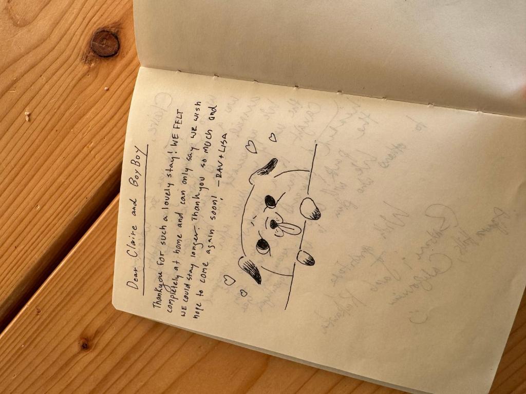 a box with writing on it on a wooden table at Cute Pug Guest Room in Copenhagen