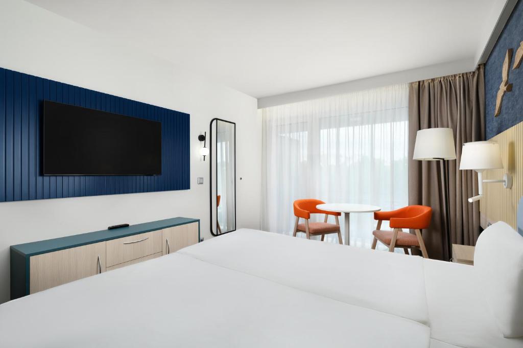 Postel nebo postele na pokoji v ubytování Danubius Hotel Annabella