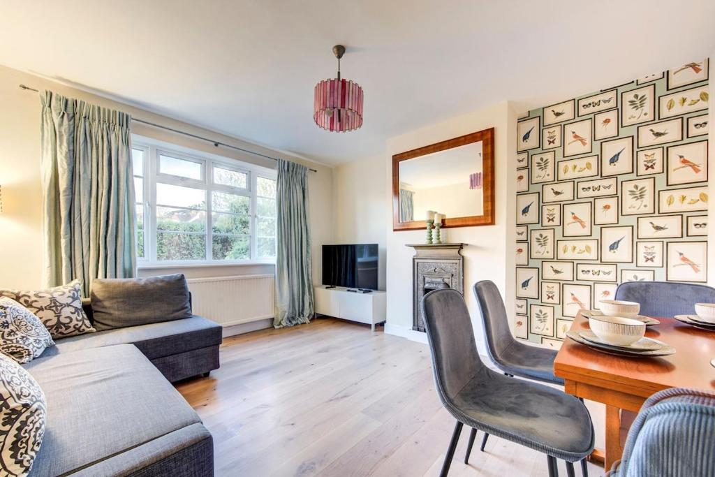 a living room with a couch and a table at Free Parking Charming Private Apt in Perivale