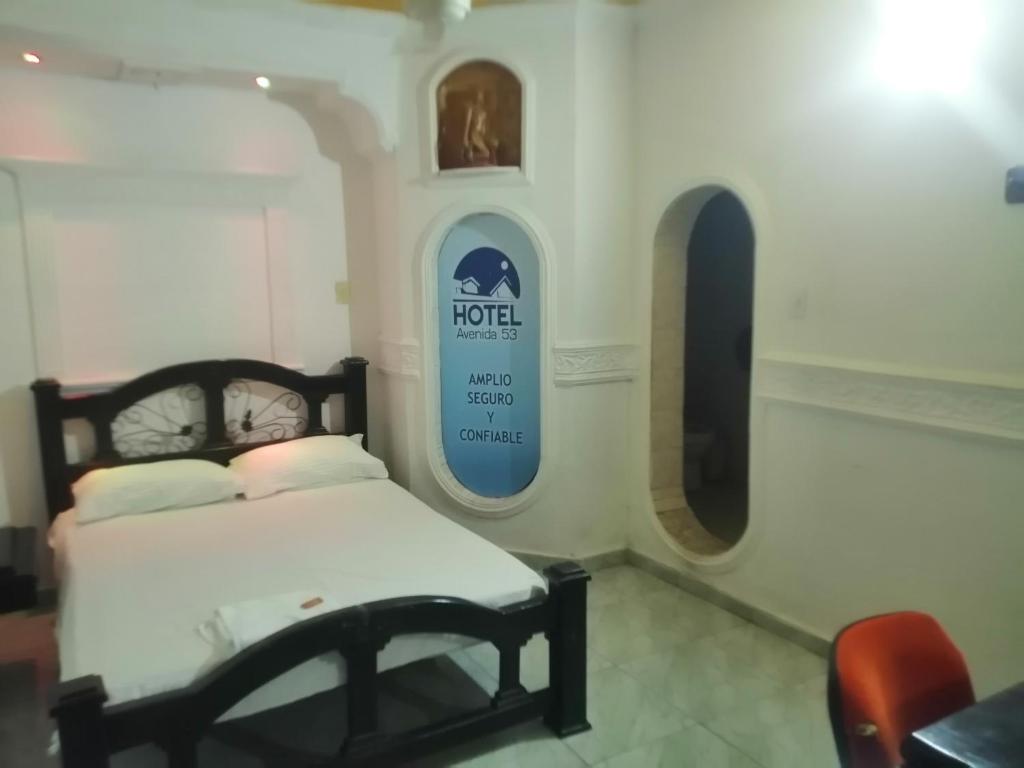 Postel nebo postele na pokoji v ubytování hotel avenida53