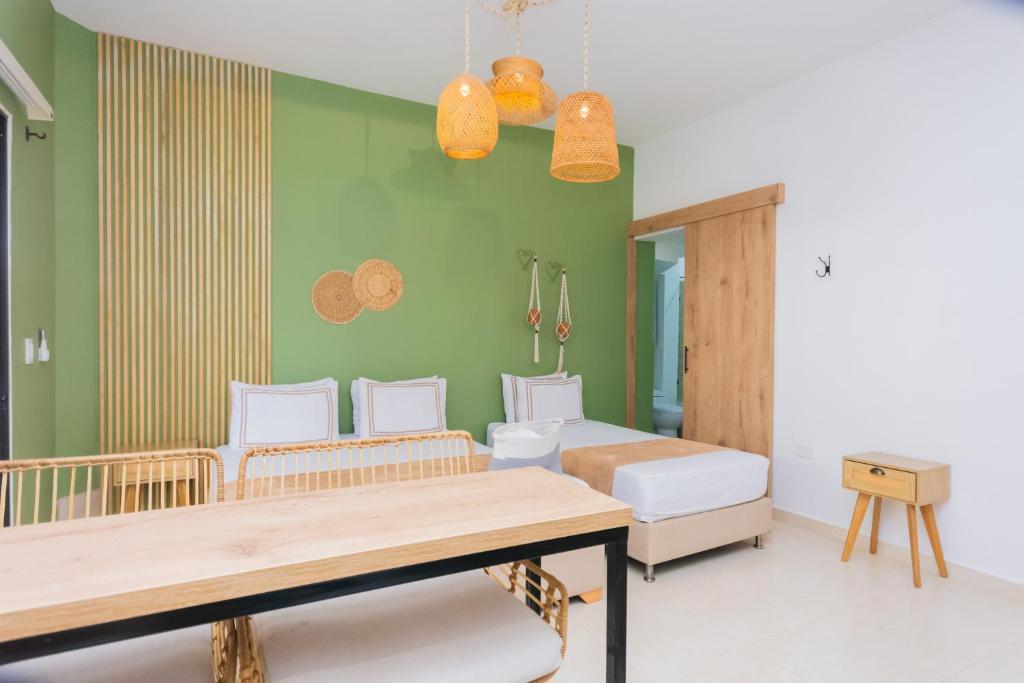Postel nebo postele na pokoji v ubytování La Casona Hotel Boutique