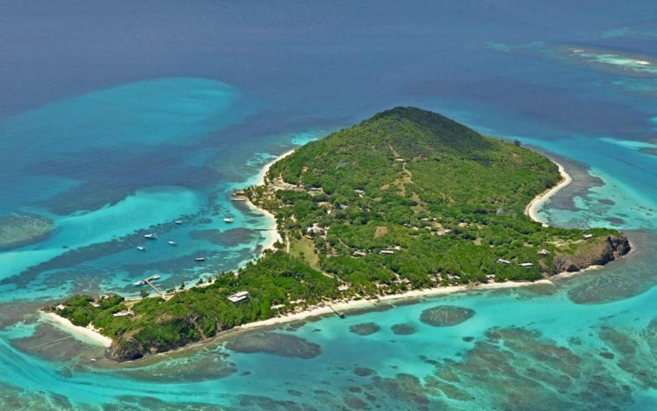 an aerial view of an island in the ocean at Petit St. Vincent Resort in Petite Martinique