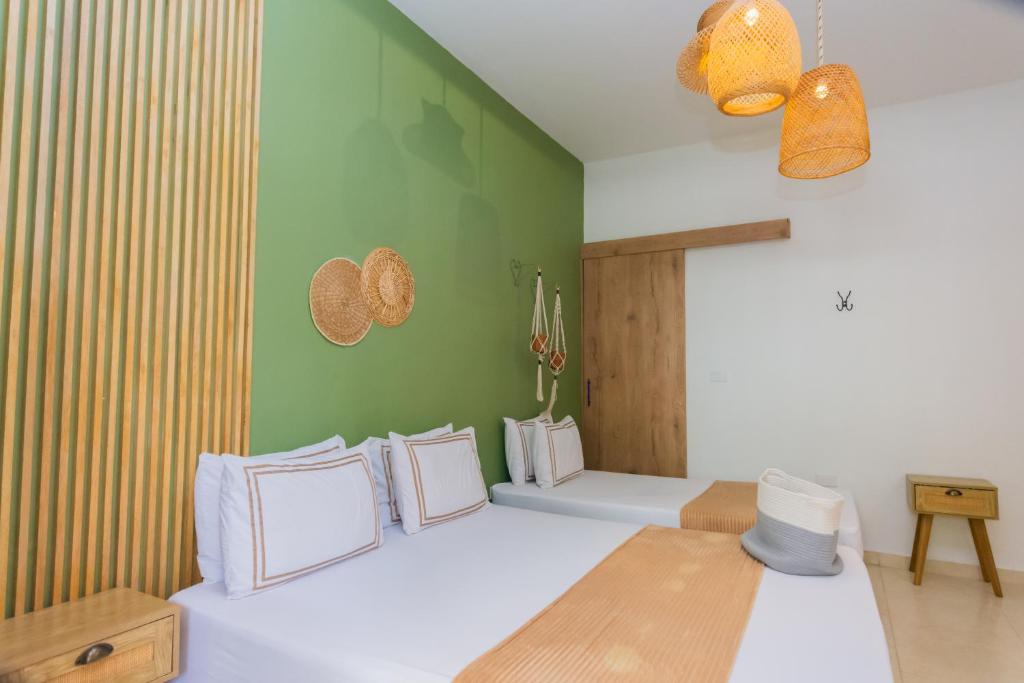 Postel nebo postele na pokoji v ubytování La Casona Hotel Boutique