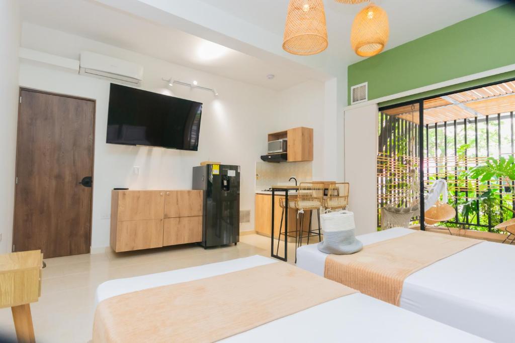 Postel nebo postele na pokoji v ubytování La Casona Hotel Boutique
