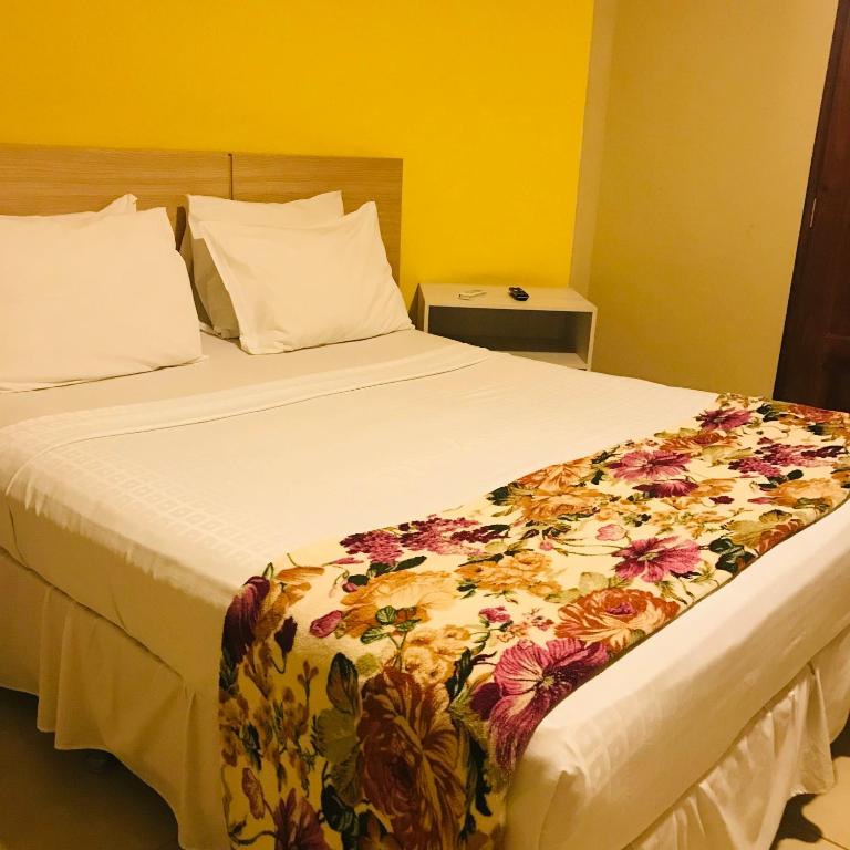 Postel nebo postele na pokoji v ubytování Hotel Pousada Latitude