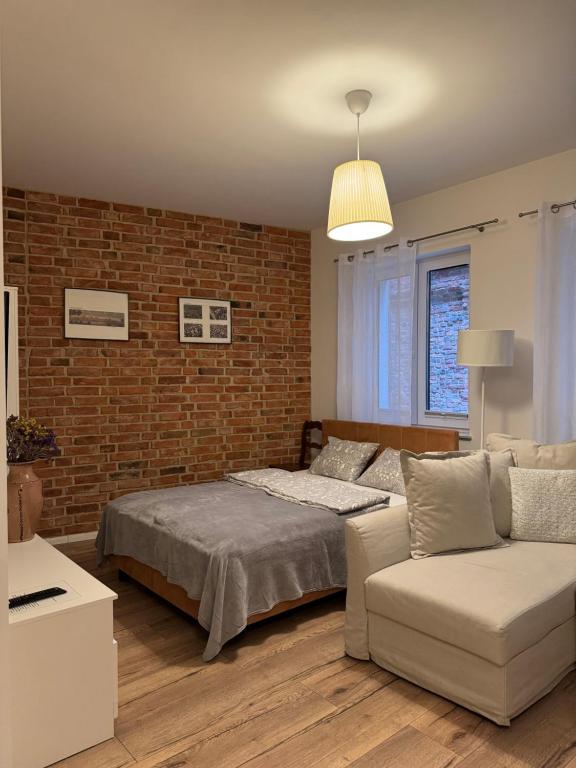 Postel nebo postele na pokoji v ubytování Apartamenty Ceglane