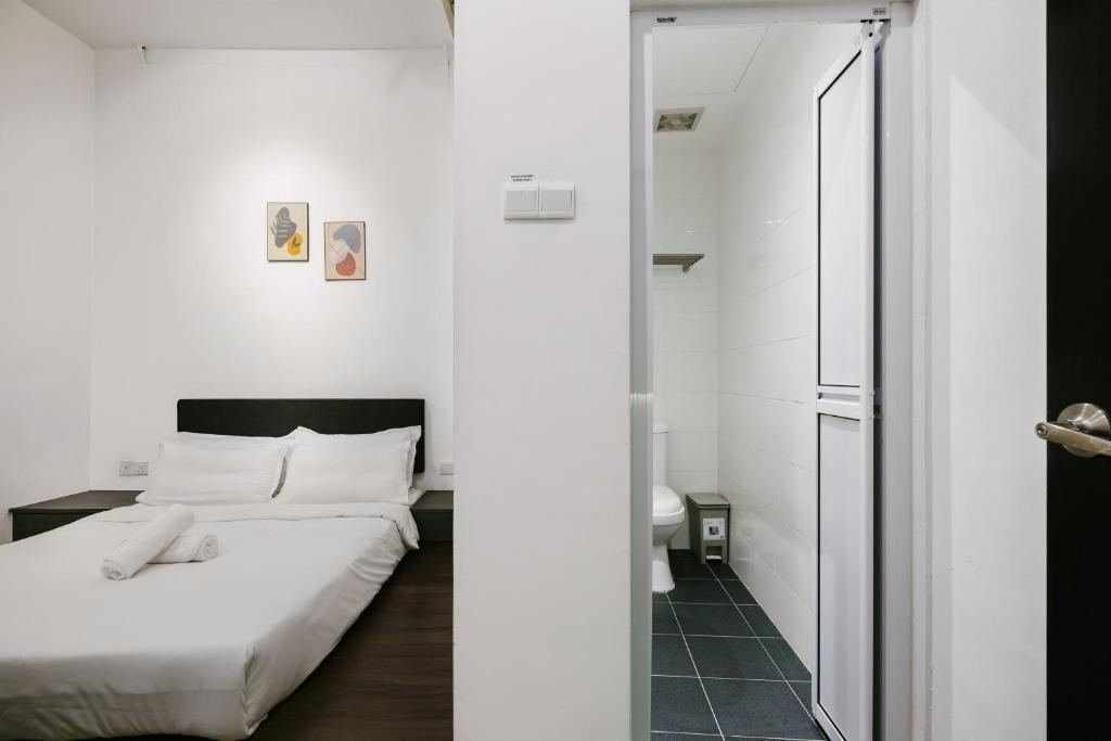 Postel nebo postele na pokoji v ubytování Kangsar Inn 73