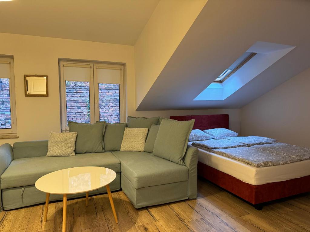 Postel nebo postele na pokoji v ubytování Apartamenty Ceglane