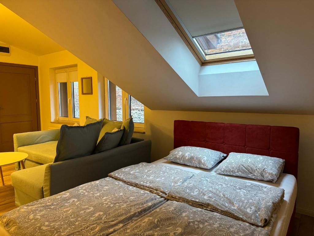 Postel nebo postele na pokoji v ubytování Apartamenty Ceglane